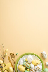 Easter celebration concept. Top view vertical photo of plates with lot of colorful easter eggs knife fork ceramic bunny and easter bouquet on isolated pastel beige background with copyspace
