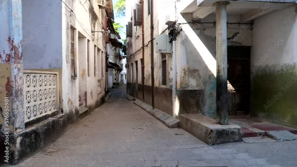 Establisher shot of Buildings and homes in poor conditions state in Stone Town Establisher shot of Buildings and homes in poor conditions state in Stone Town