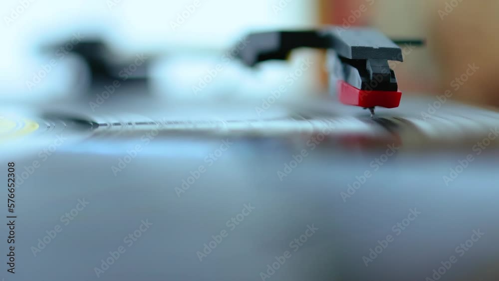 Needle spinning on vinyl record on old gramophone Needle spinning on vinyl record on old gramophone