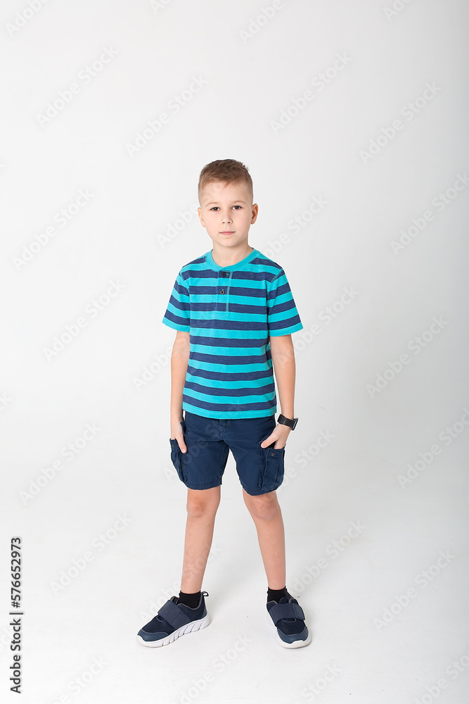The winning child, highlighted on a white background, will show his emotions. Isolated on a white background. The winning child, highlighted on a white background, will show his emotions. Isolated on a white background.