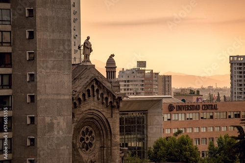 Bright sunset in Santiago Chile. Cityscape with sunset sky. Central University in Santiago