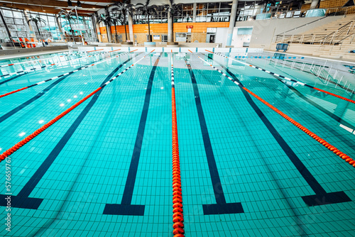 Swimming-Pool with equipment and large windows with a view outside