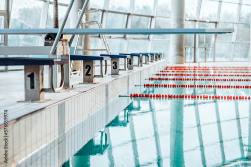 Swimming-Pool with equipment and large windows with a view outside