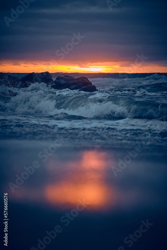 Waves at the danish shore at late sunset. High quality photo