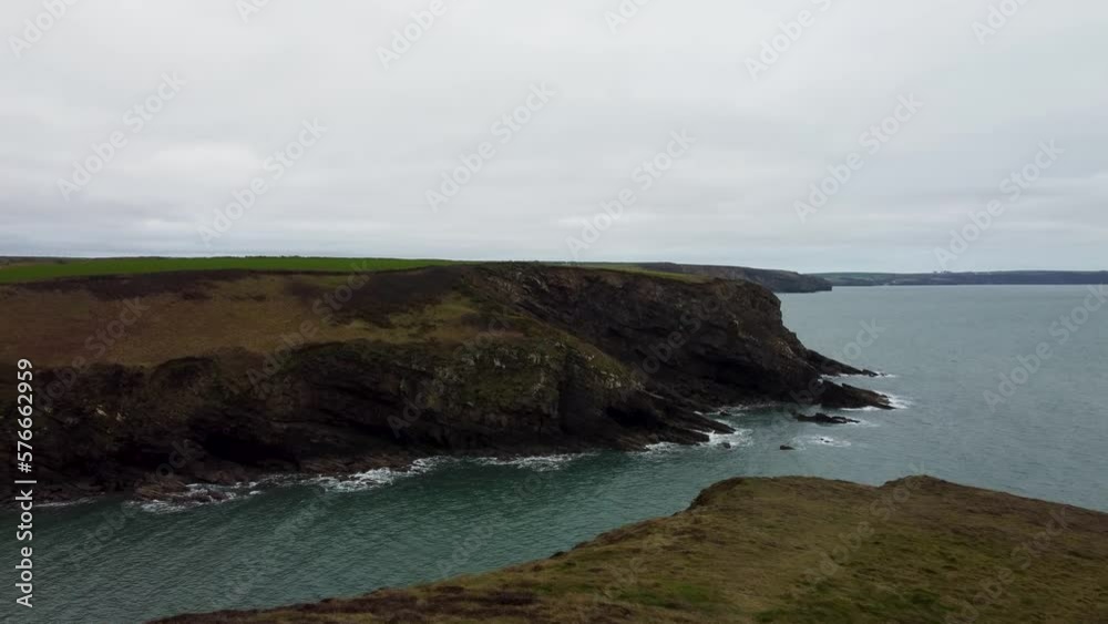 Cliff Top Drone Shot Pushing Towards Edge with Sea Waves and Dramatic Rocky Pembrokeshire Coastline UK 4K Cliff Top Drone Shot Pushing Towards Edge with Sea Waves and Dramatic Rocky Pembrokeshire Coastline UK 4K