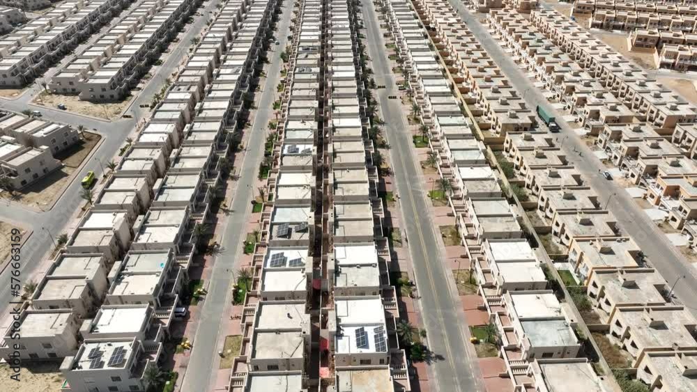 Aerial View Of Rows Of Modern Houses Bahria Town Housing Estate In Karachi. Dolly Forward, Tilt Up Aerial View Of Rows Of Modern Houses Bahria Town Housing Estate In Karachi. Dolly Forward, Tilt Up