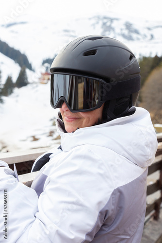Woman Skier In Goggles And Snow Helmet