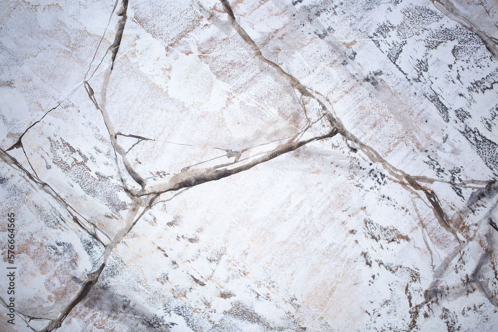 Fototapeta premium Background Stone wall background with abstract spots. Beautiful gray marble texture with stains, abstract surface background. Finishing stone for building cladding. Furniture granite.