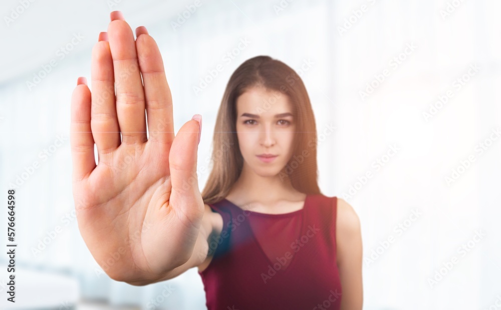 Young woman show stop sign with hand Young woman show stop sign with hand