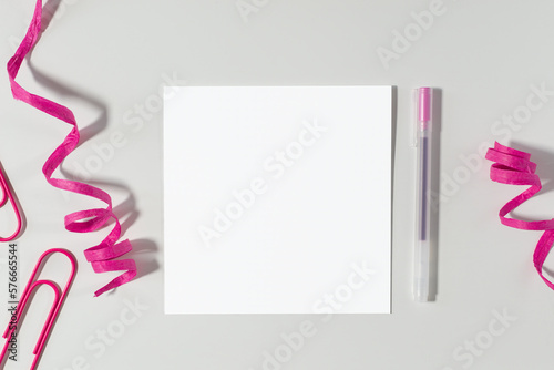 Greeting card mockup on desk top-down view (ID: 576665544)