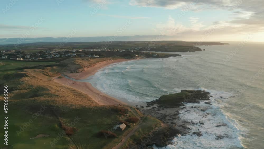 Aerial view of Constantine Bay at sunset during hightide, Cornwall, United Kingdom. Aerial view of Constantine Bay at sunset during hightide, Cornwall, United Kingdom.