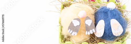 Obraz na płótnie two handmade fluffy easter bunnys and colorful eggs w salonie