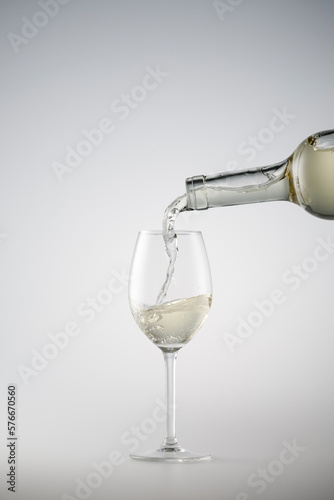 White wine being poured into a wine glass