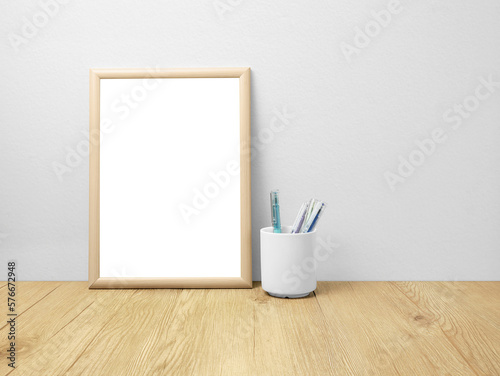 Blank frames mockup on wooden floor with pen