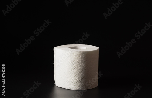 Toilet paper for personal hygiene on a black background.