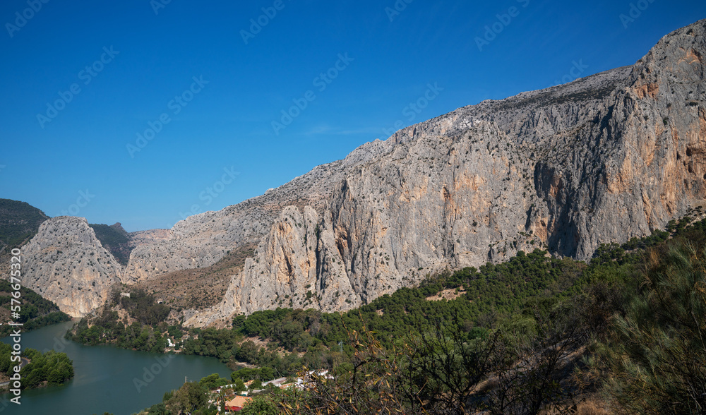 Views of the lake from the King's Trail (El Caminito del Rey). Mountain trail along steep cliffs in Chorro Gorge, Malaga, Andalusia, Spain.