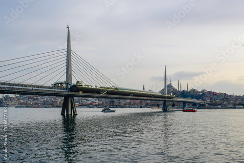 Long exposure. View of Haliç Metro Bridge connecting Azapkapı (Beyoğlu) and Unkapanı (Fatih) (Halic Metro Bridge). blue sky Istanbul Turkey 