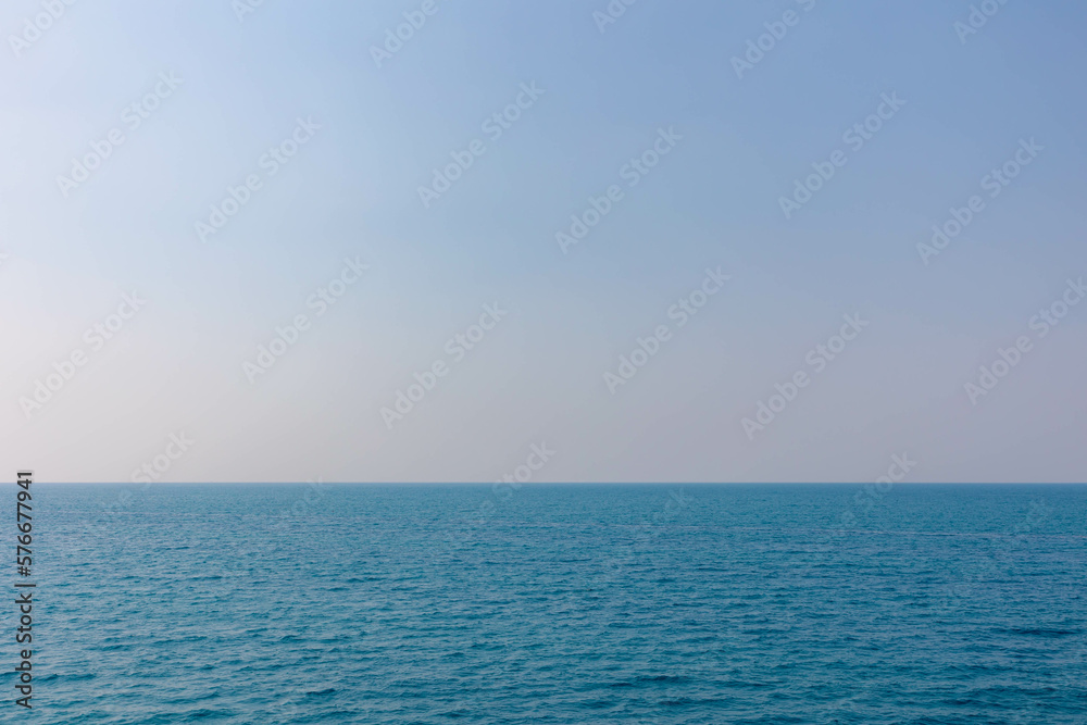 Beautiful day in summer with deep blue sea with blue clear sky, Landscape view with ocean and skyline, Nature background with free copy space for your text.