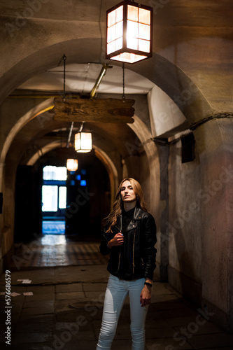 Portrait of beautiful woman in the evening with city light