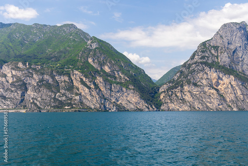 Wooded mountain top and rock wall on the northern shore of Lake Garda in Italy