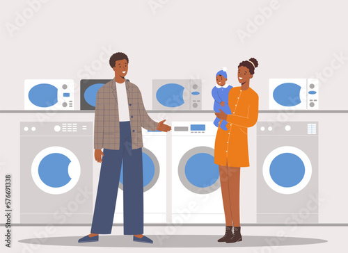 Young african american family will choose washing machine in a shopping center of household appliances supermarket
