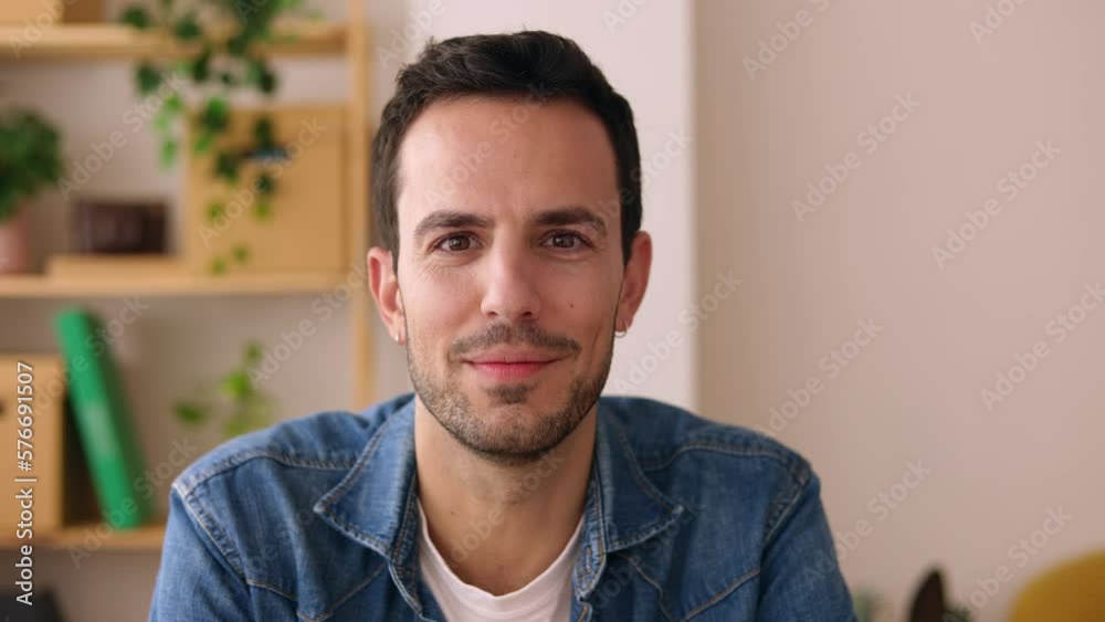 Point of view from camera with handsome casual business young adult man having a video call from home office