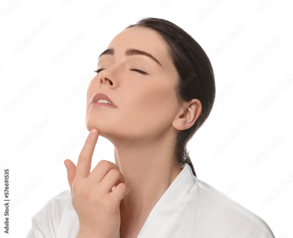 Young woman massaging her face on white background Young woman massaging her face on white background
