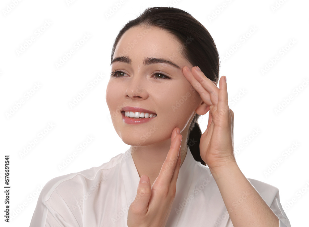 Young woman massaging her face on white background Young woman massaging her face on white background
