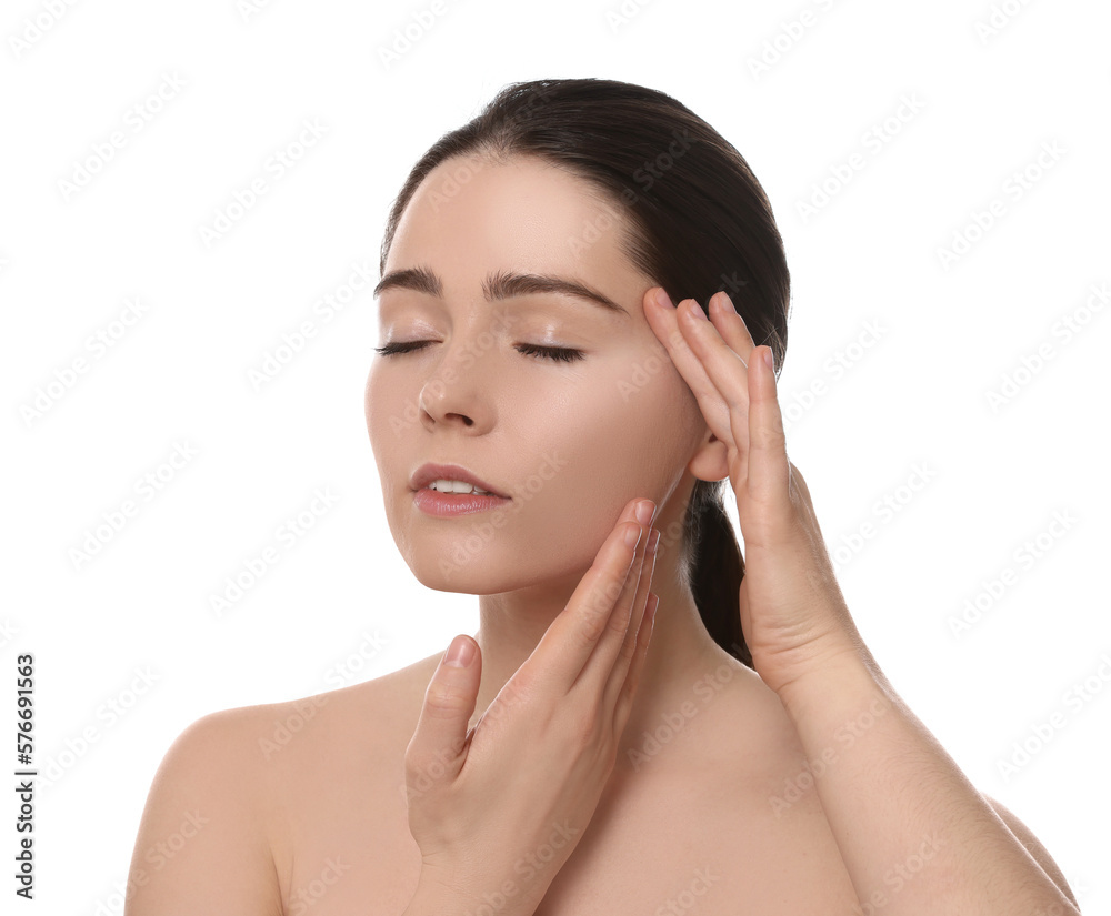 Young woman massaging her face on white background Young woman massaging her face on white background