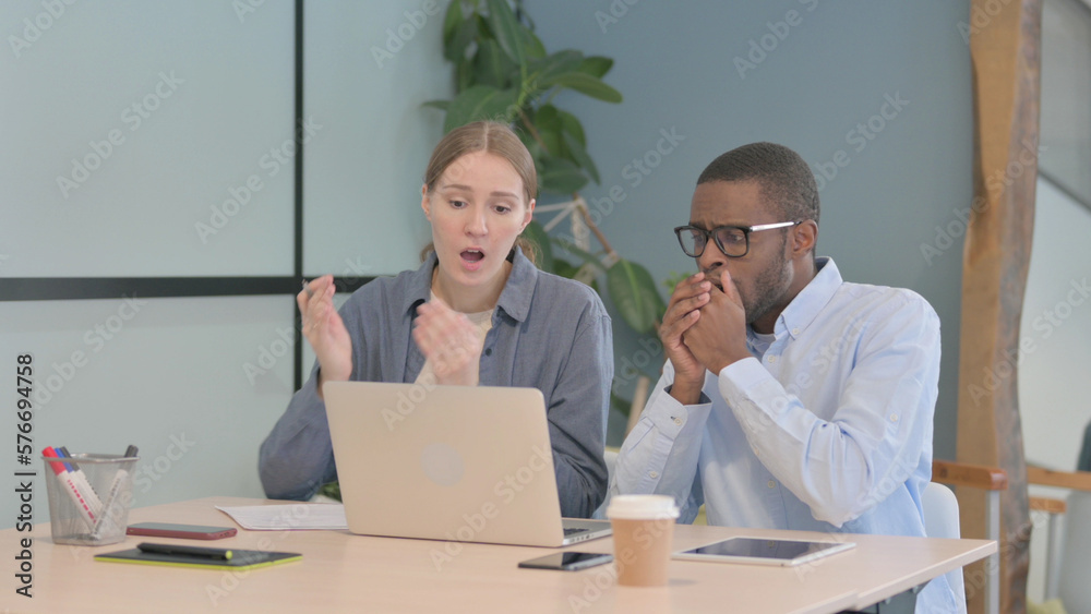 Multiethnic Young Business People Reacting to Loss at Work Multiethnic Young Business People Reacting to Loss at Work