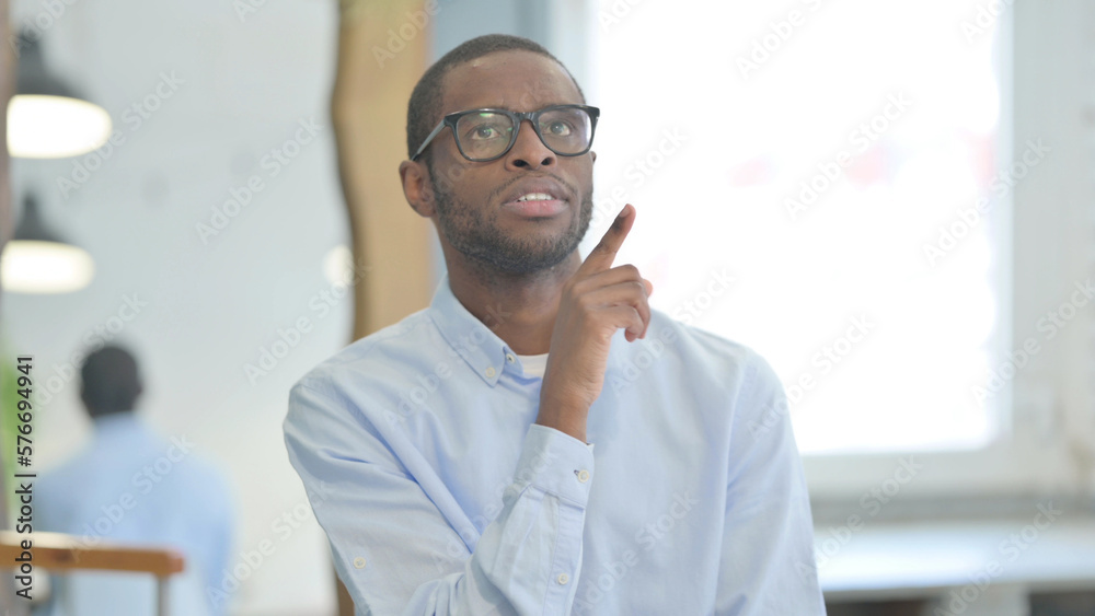 Fototapeta premium Portrait of Brainstorming African Man with an Idea