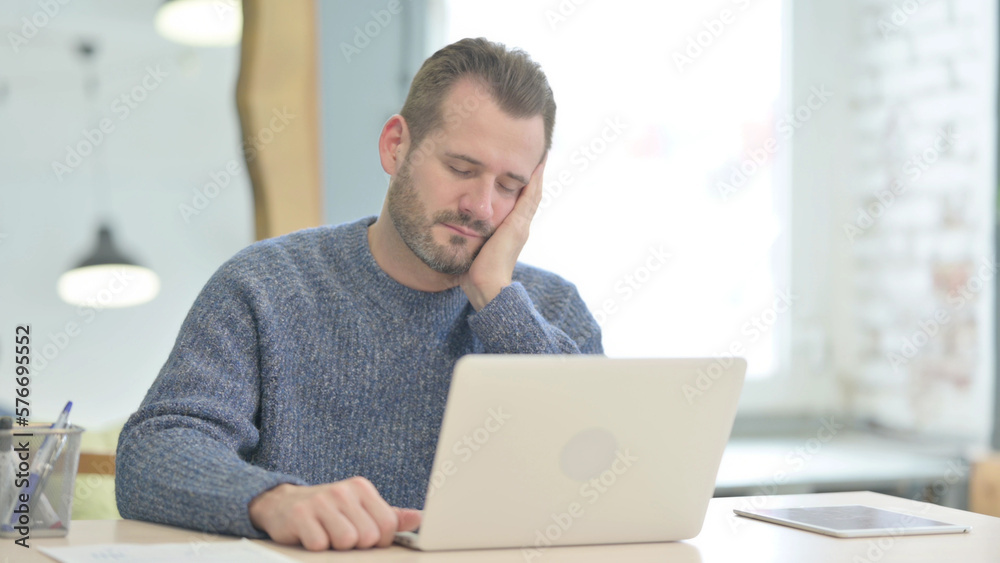 Middle Aged Man Sleeping while Sitting at Work Middle Aged Man Sleeping while Sitting at Work
