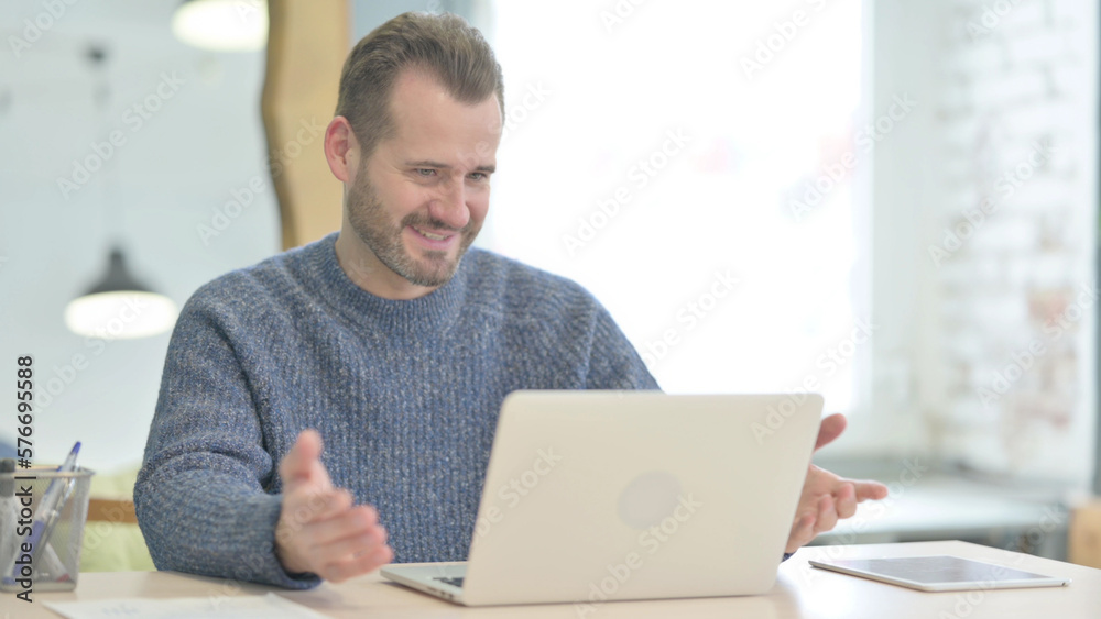 Middle Aged Man Doing Video Chat on Laptop Middle Aged Man Doing Video Chat on Laptop