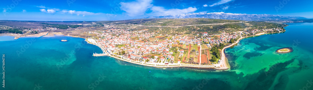 Coastal town of Posedarje waterfront and Velebit mountain aerial panoramic view