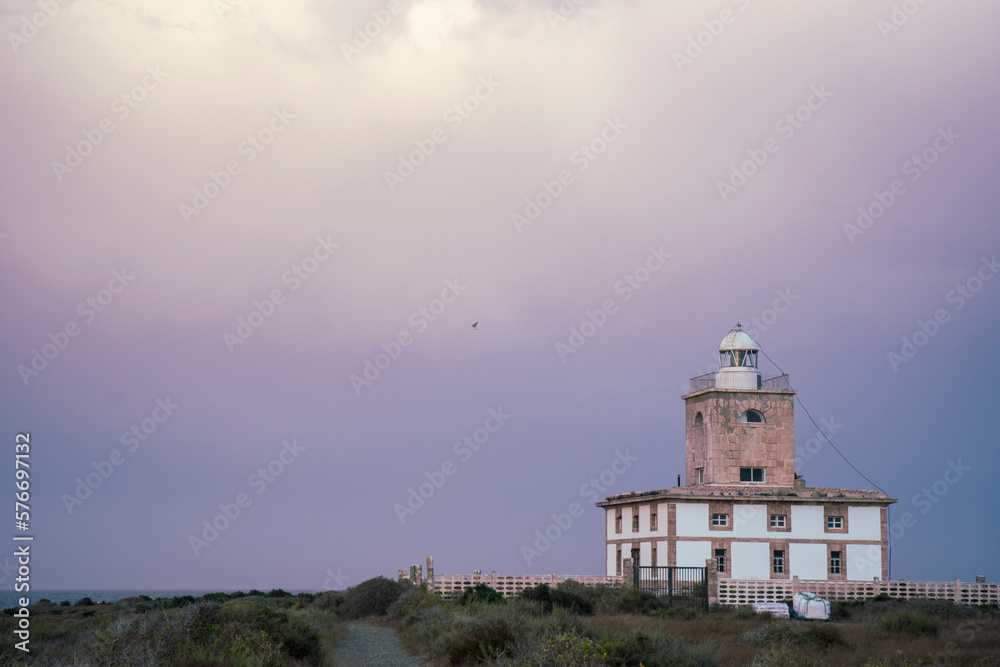 Tabarca island Alicante Spain : Nova Tabarca is the largest island in the Valencian Community, and the smallest permanently inhabited islet in Spain . The lighthouse by sunset.