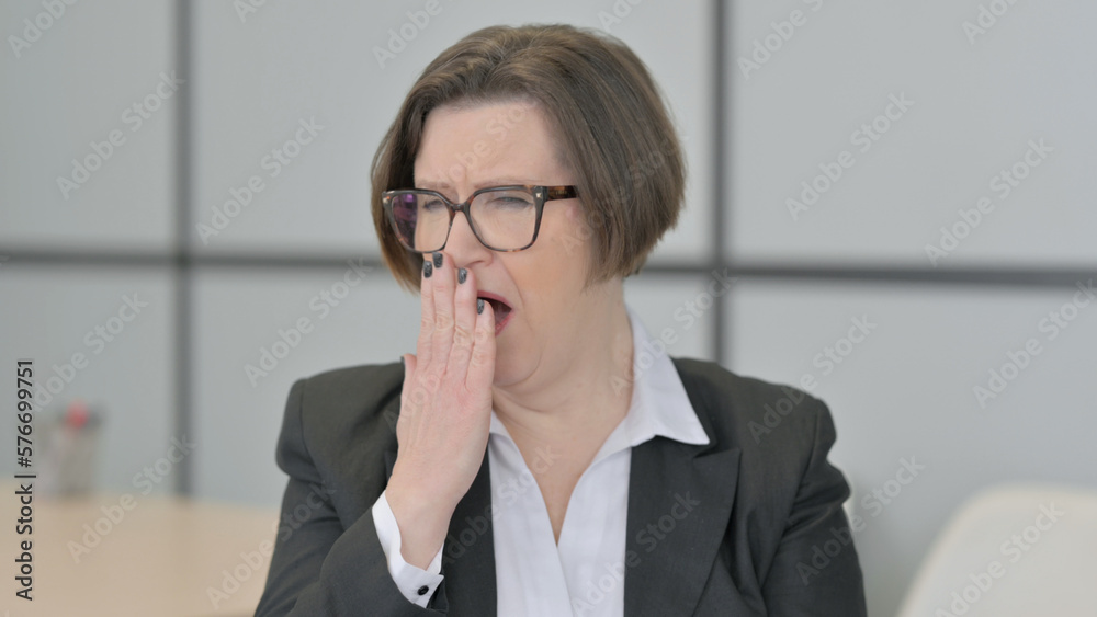 Portrait of Yawing Old Businesswoman Feeling Tired Portrait of Yawing Old Businesswoman Feeling Tired
