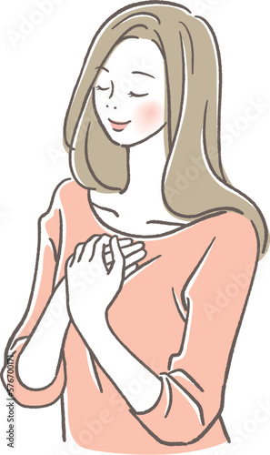 胸に手を当てて目を閉じる女性