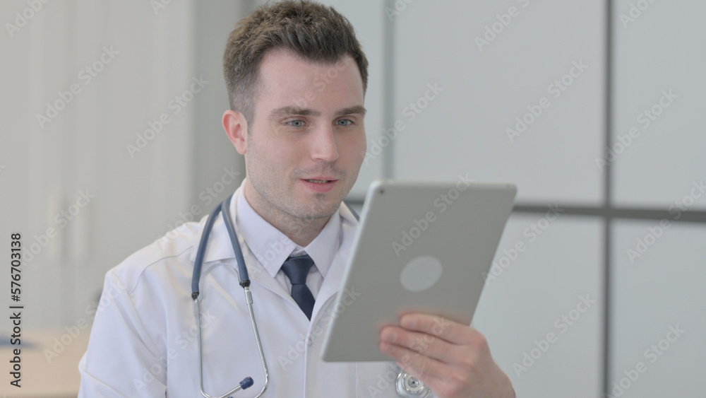 Online Video Chat by Young Doctor on Tablet Online Video Chat by Young Doctor on Tablet