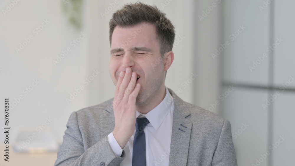 Portrait of Yawing Tired Young Businessman Portrait of Yawing Tired Young Businessman