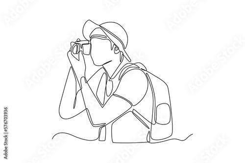 Continuous one line drawing happy boy take a photo with smartphone. Travel experience concept. Single line draw design vector graphic illustration.