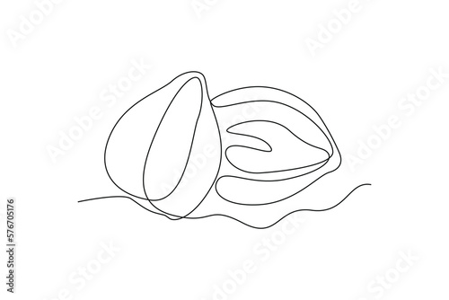 Continuous one line drawing candlenut. Vegetable concept. Single line draw design vector graphic illustration.
