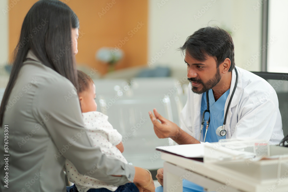 A kind doctor who treats pediatric patients. The child and his family brought him to see the doctor at the hospital because he was ill.