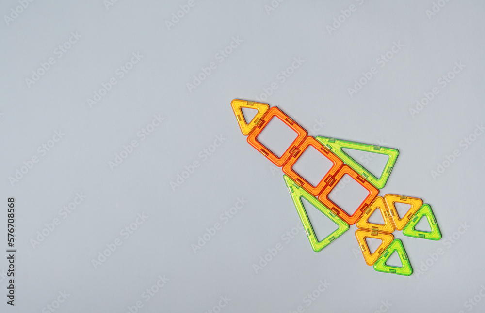 Rocket model from a magnetic construction kit on a neutral background ...