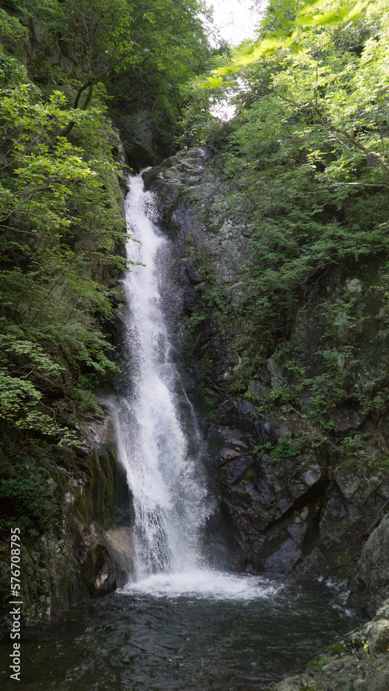 a strong vertical fall of a waterfall in a waterfall a strong vertical fall of a waterfall in a waterfall
