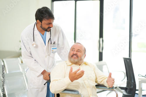 An elderly male patient with high body fat, obesity, sees a doctor at the hospital due to body problems because of a lot of weight.