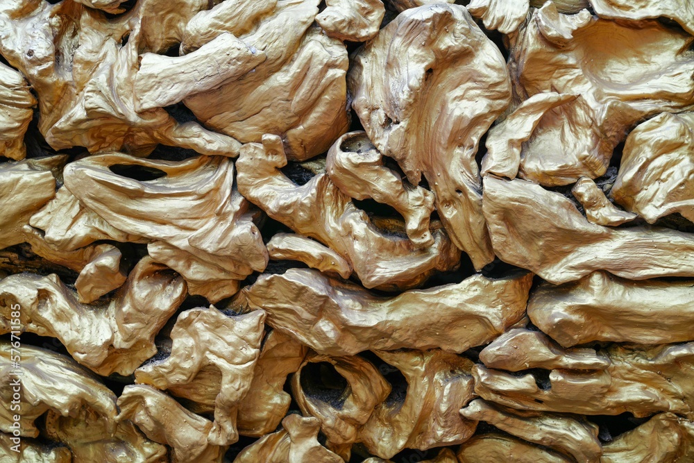 Gold-painted wooden panels arranged for the background image.