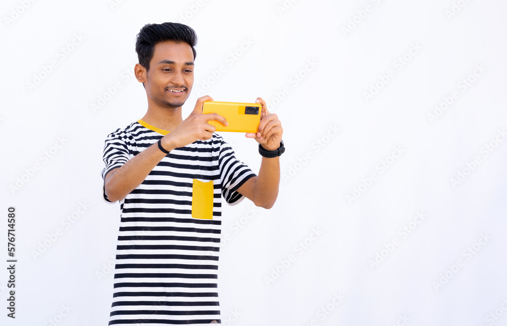  Teenage Boy taking photos and smiling expressions, taking photos with Orange mobile phone
