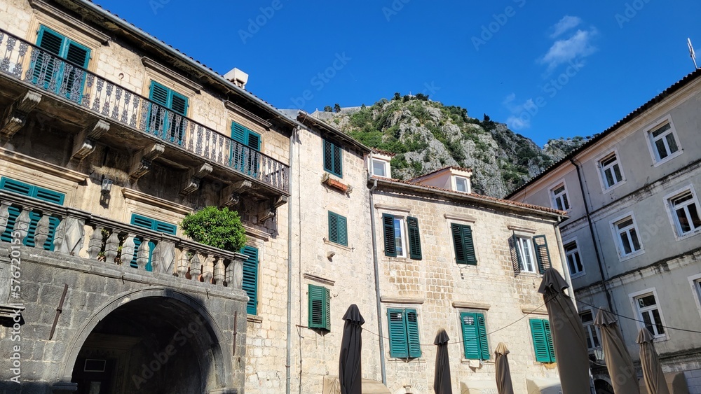group of buildings with green shutters and balconies. Kotor, Montenegro group of buildings with green shutters and balconies. Kotor, Montenegro