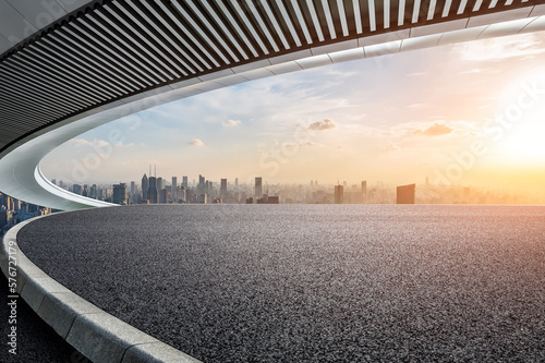 Photography Asphalt road platform and Bridge with the city skyline at sunset in Shanghai, China