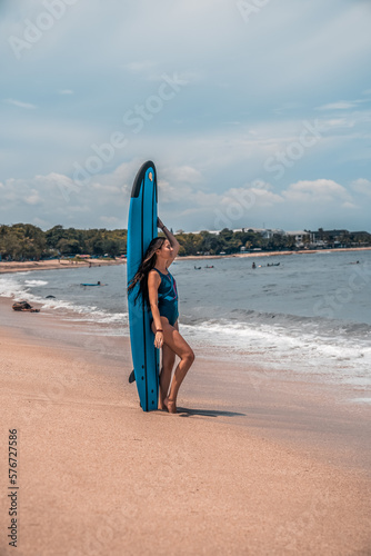 Surfing. A surfer on the waves in the ocean off the coast of Asia on the island of Bali in Indonesia. Sports and extreme. Beauty and health. Fashion and beach style.